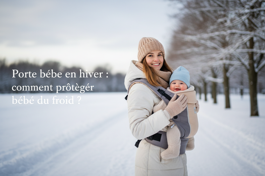 Maman et bebe en porte bebe hiver exterieur neige